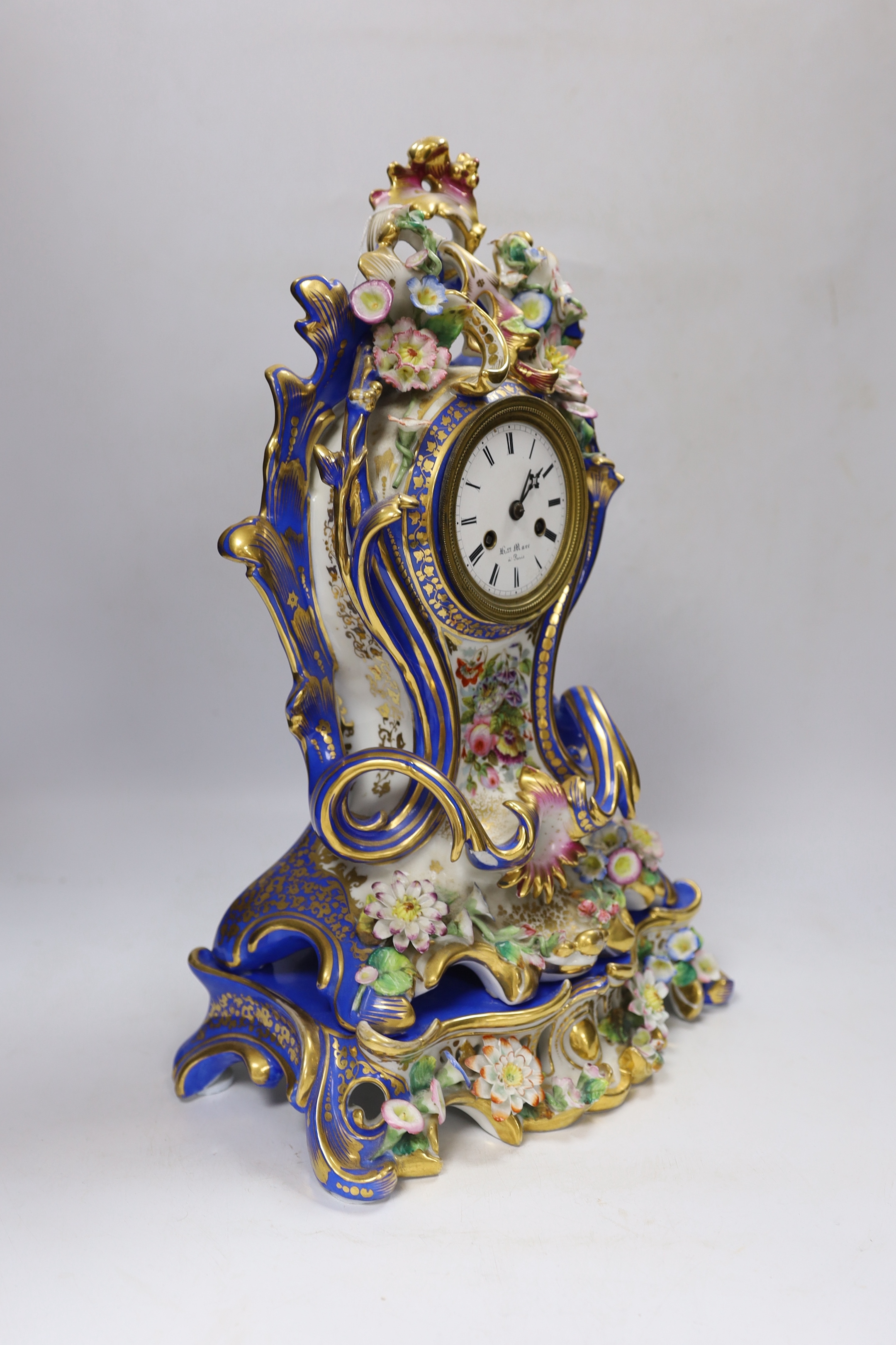 Henri Marc of Paris, a mid 19th century floral encrusted and painted balloon shaped eight day mantel clock, striking on a bell, with key, 42cm